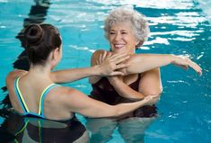 A person practicing hydrotherapy for chronic pain relief in a warm water pool